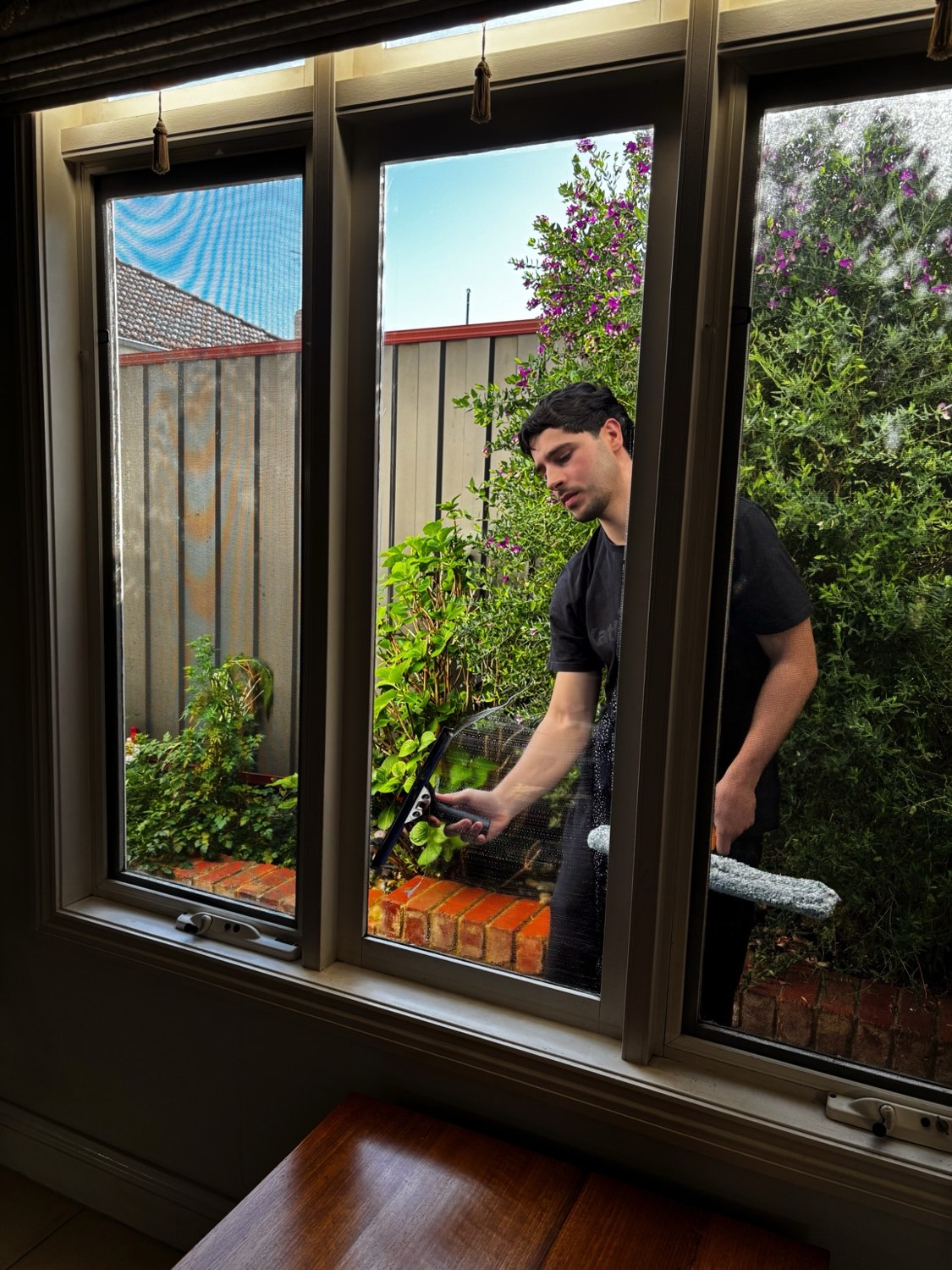 Matthew cleaning residential windows